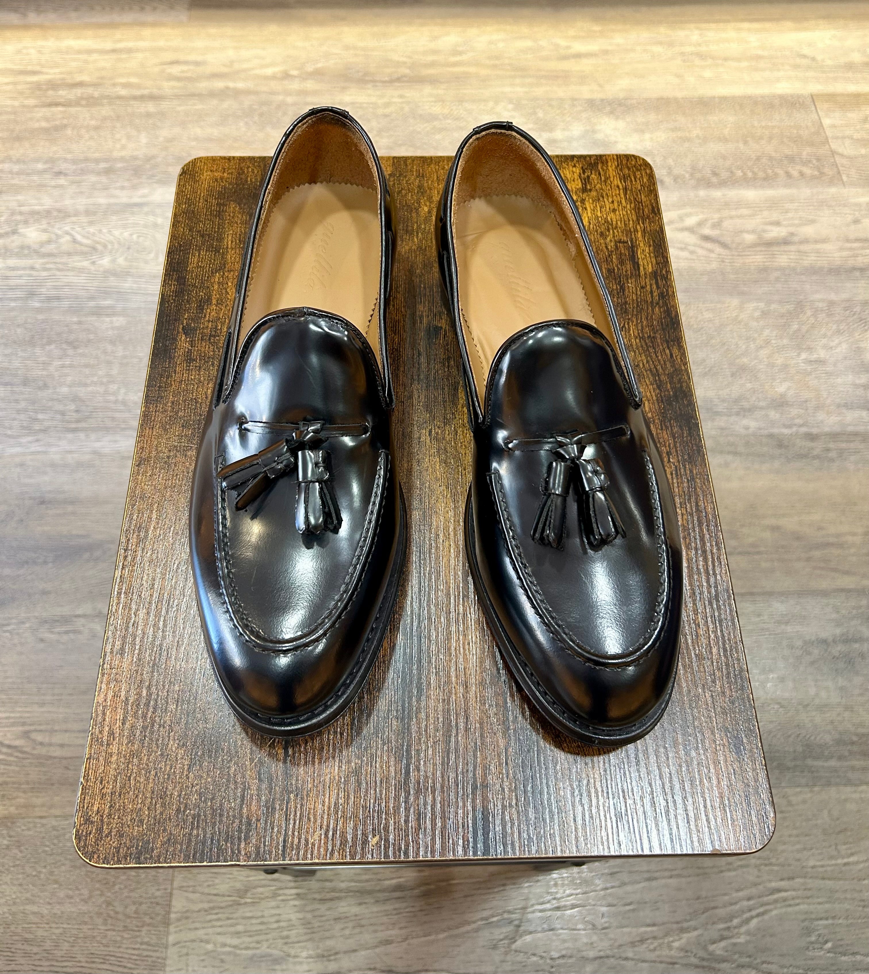 Black tassel in abrasive leather