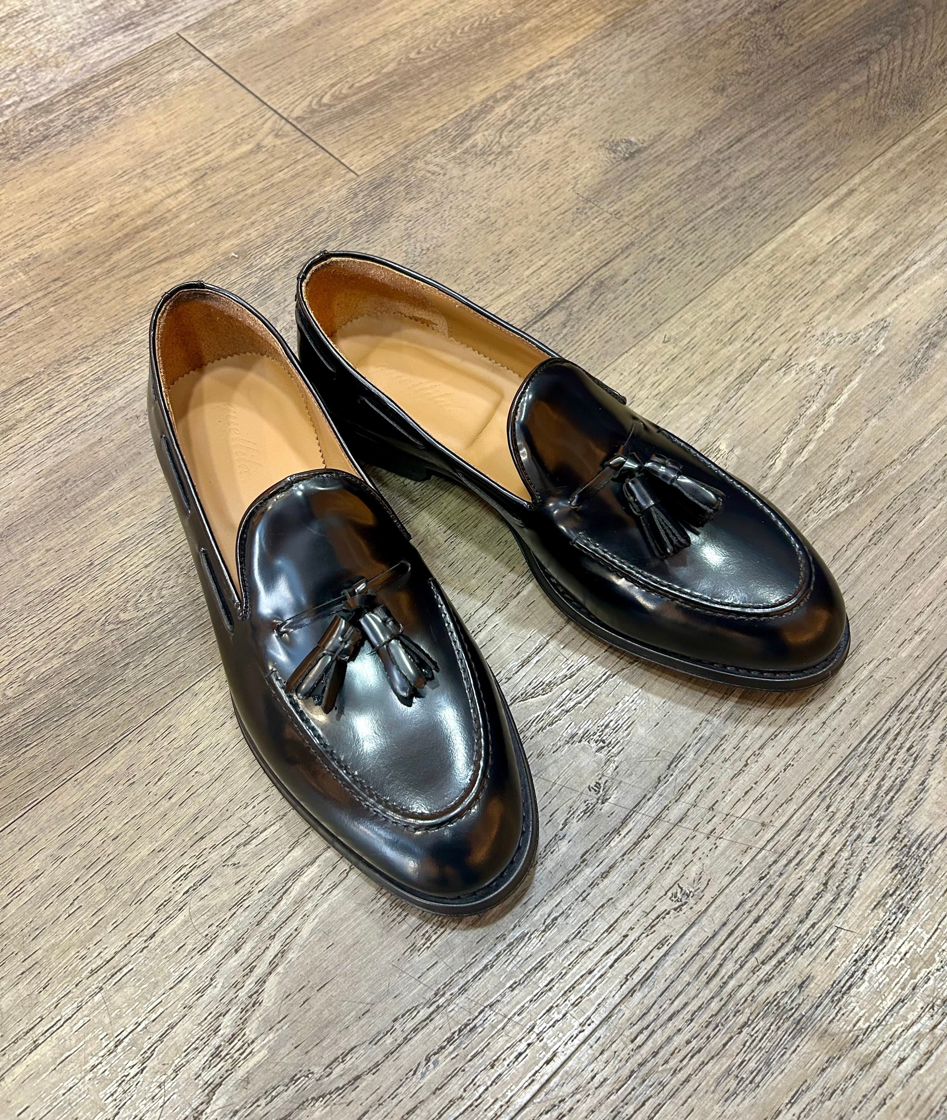 Black tassel in abrasive leather