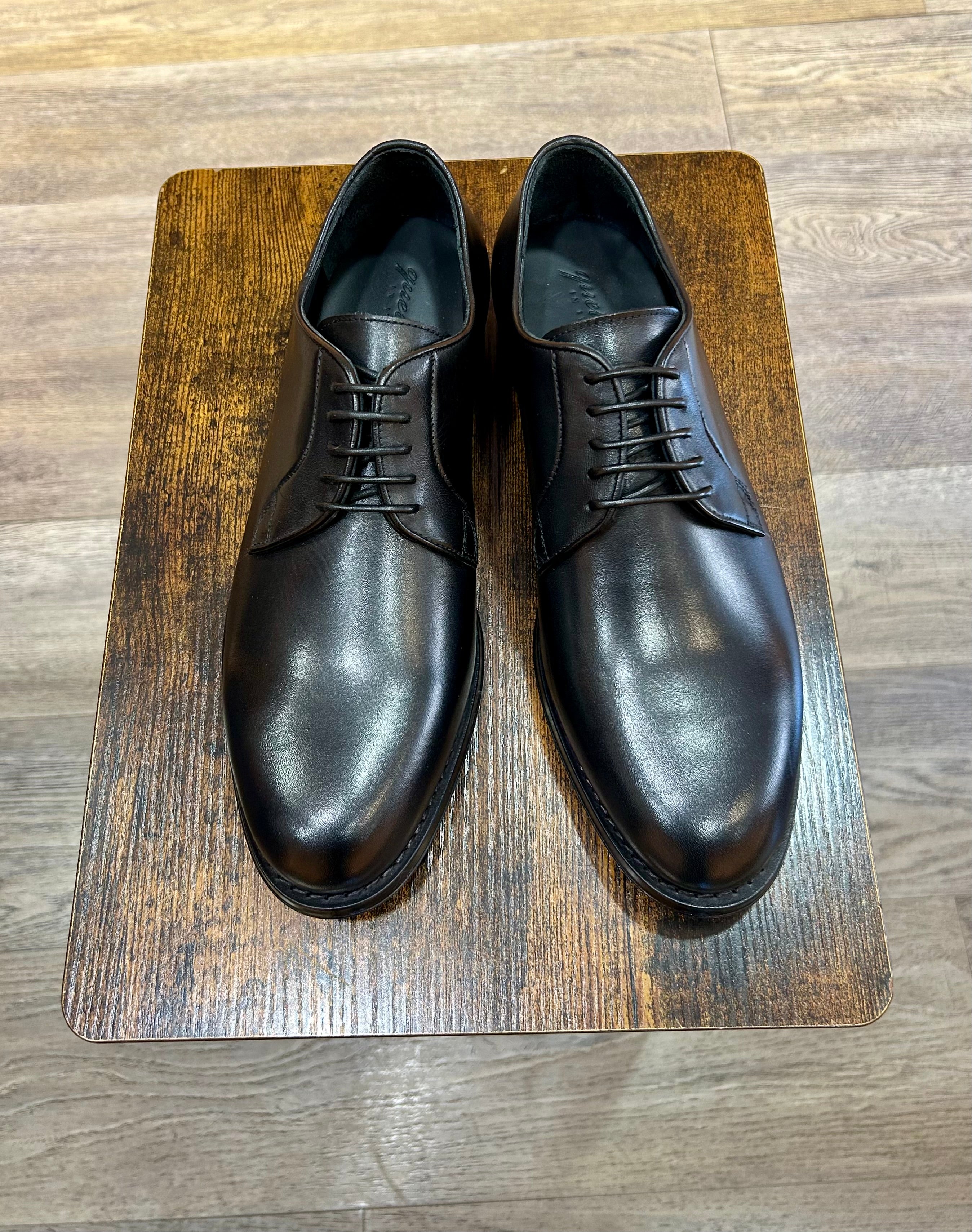 Black leather derby