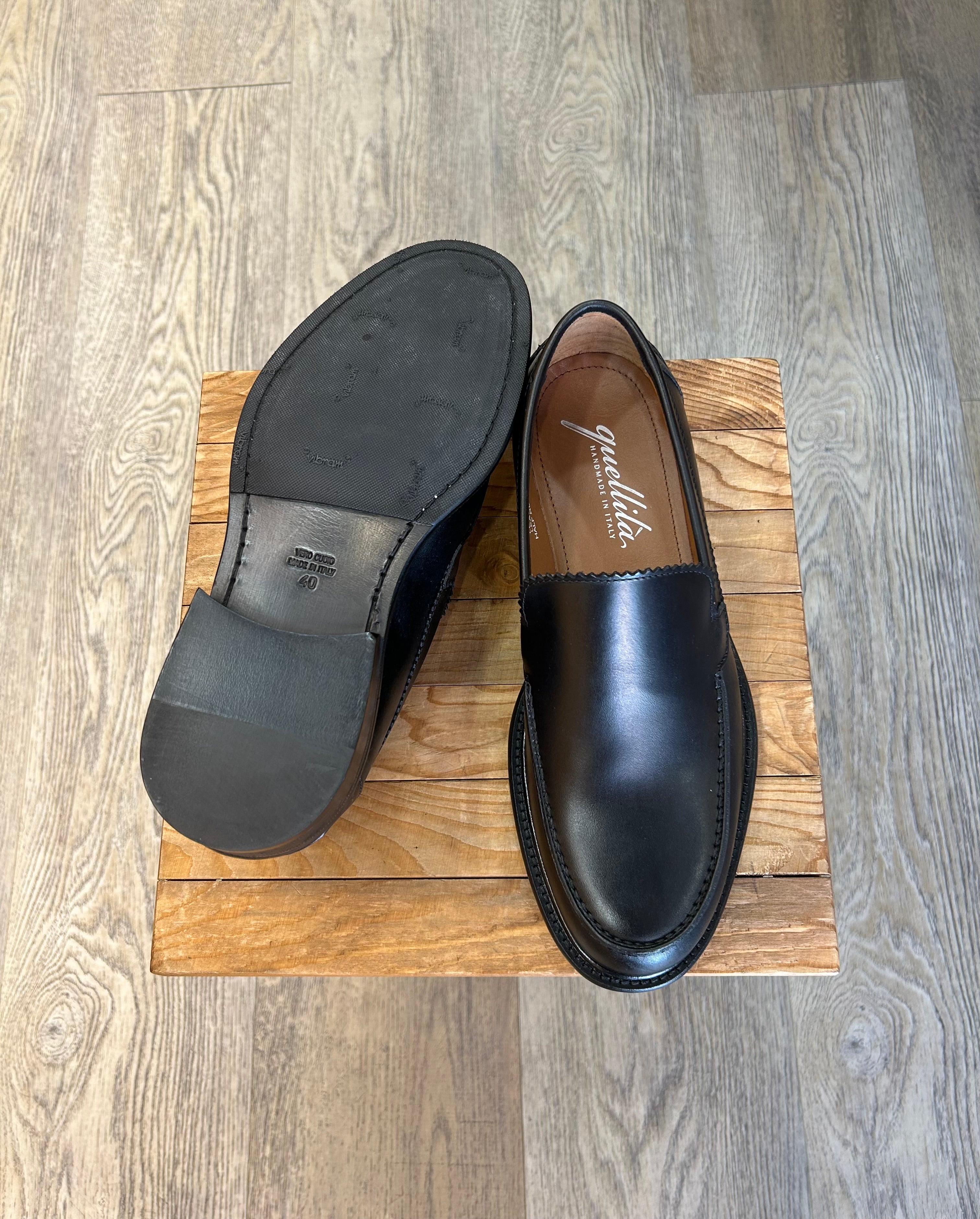 Black leather loafers