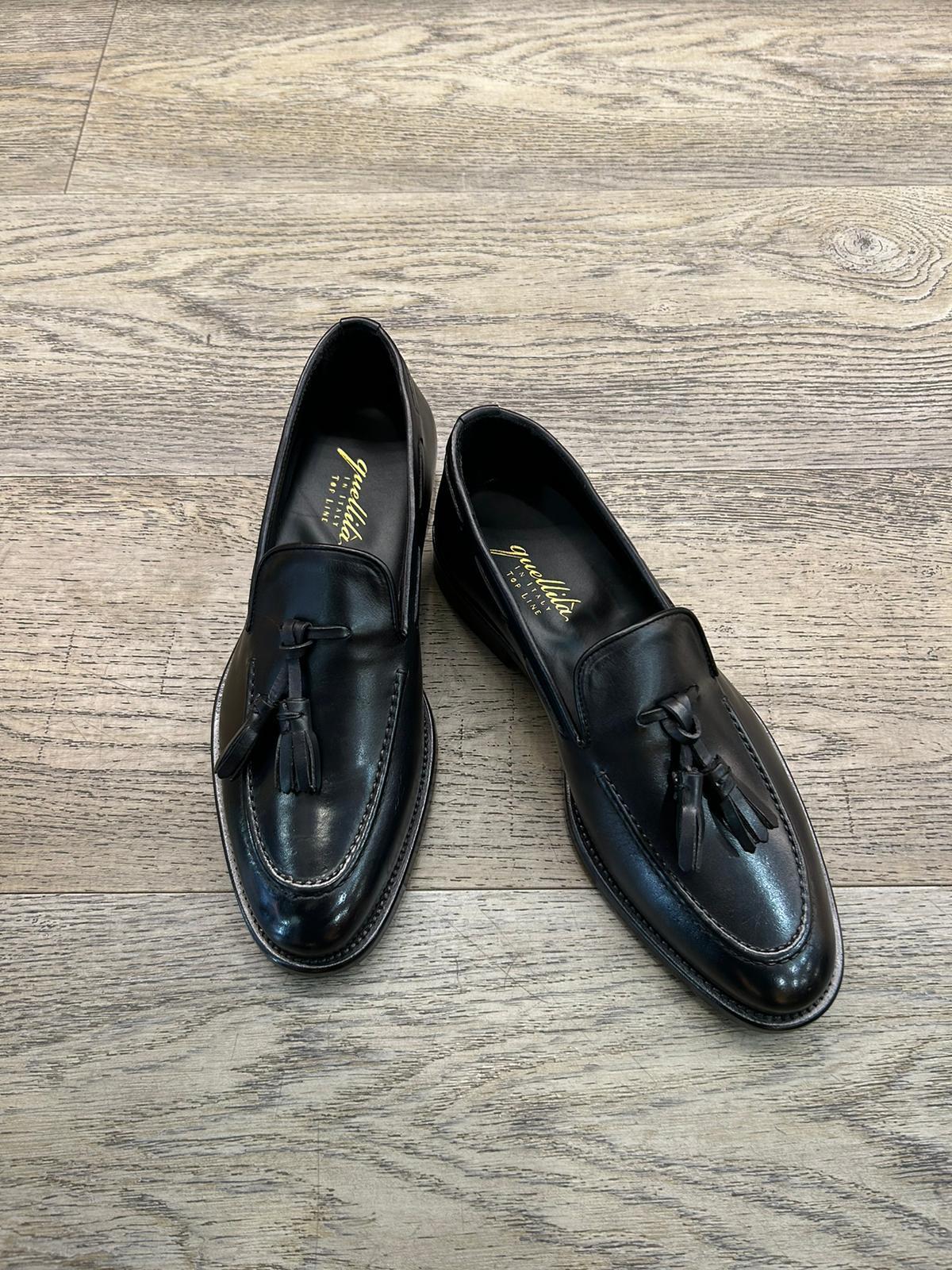 Black leather slippers