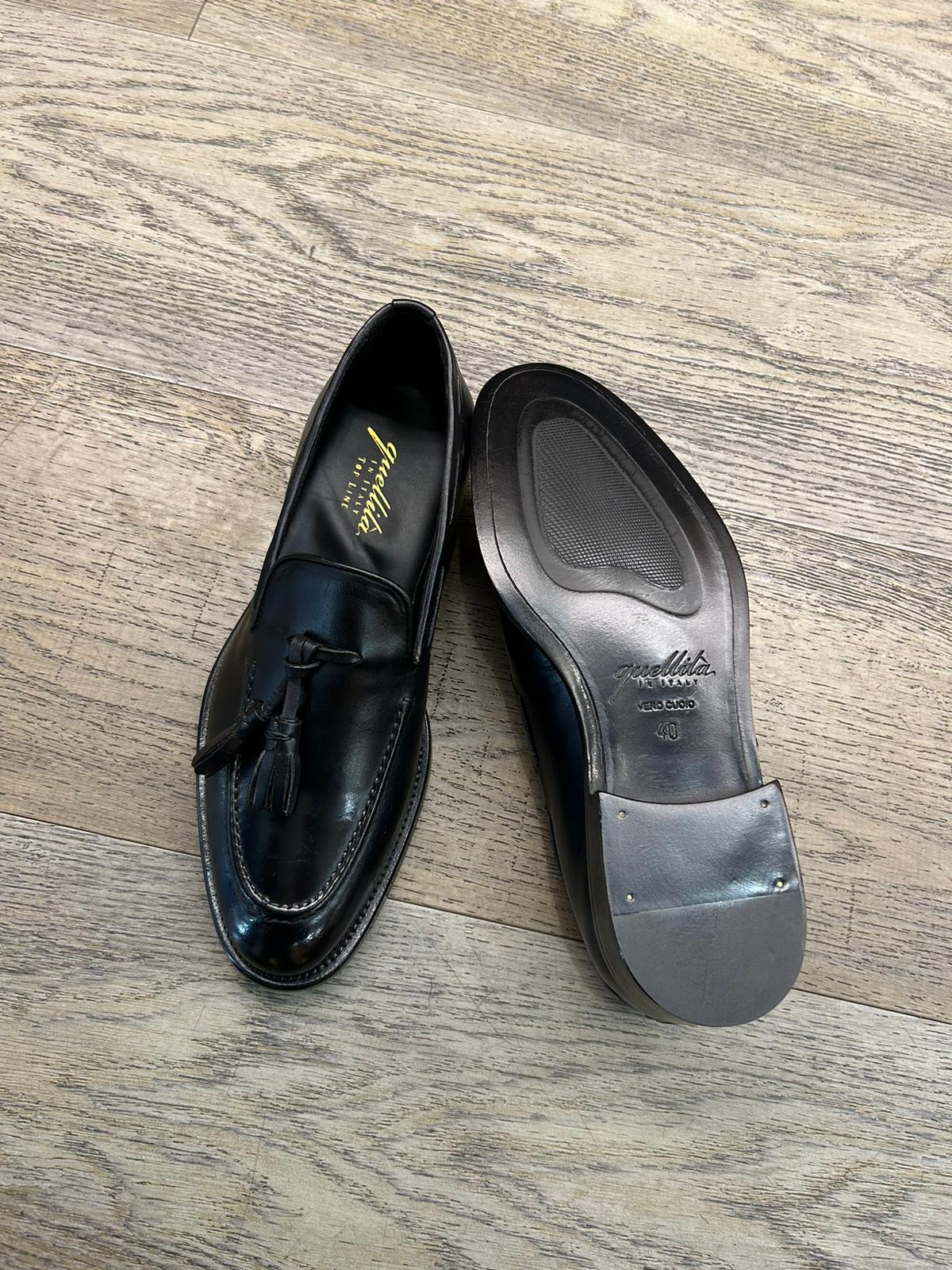 Black leather slippers