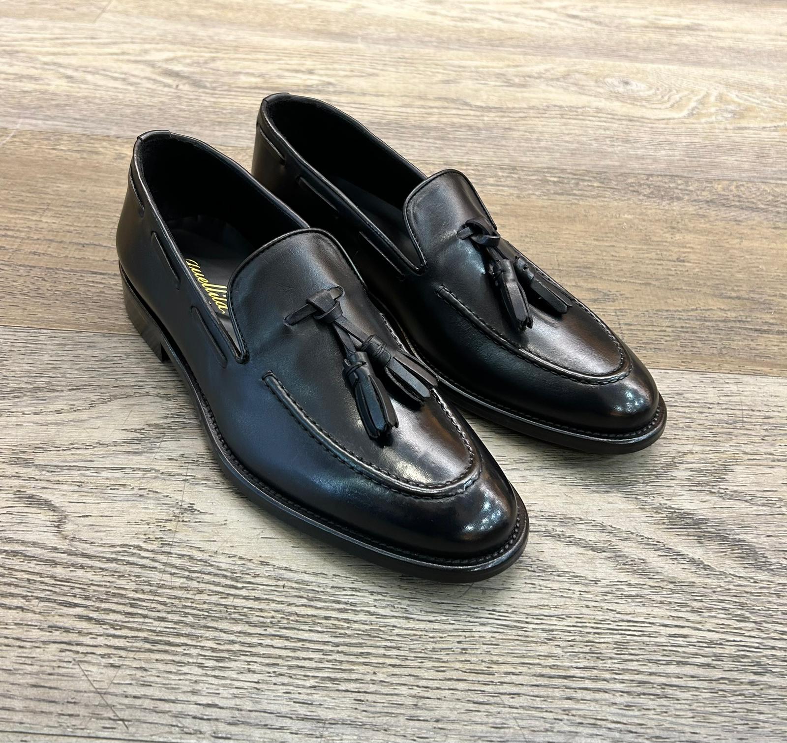 Black leather slippers